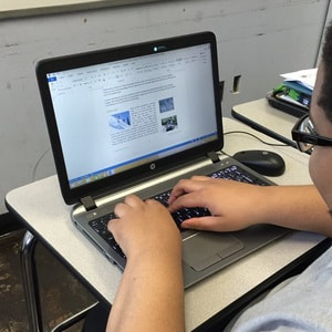 OCS student working on laptop